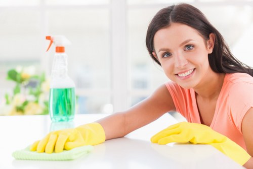 Carpet cleaning professional preparing equipment for a booked service